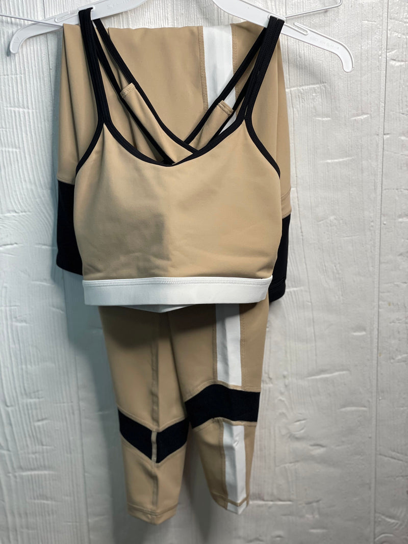 Women's workout tan leggings with elongating white lines wrapping around the legs. Brown on tummy band and around ankles. Tummy control/high waisted. 4 way stretch to move comfortably with you as you workout. Super soft. 